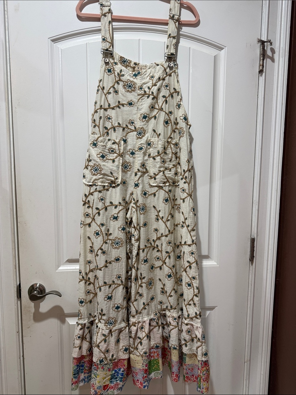 NWOT. POL Cream Floral Vine Overalls with Multicolor Patch Hem